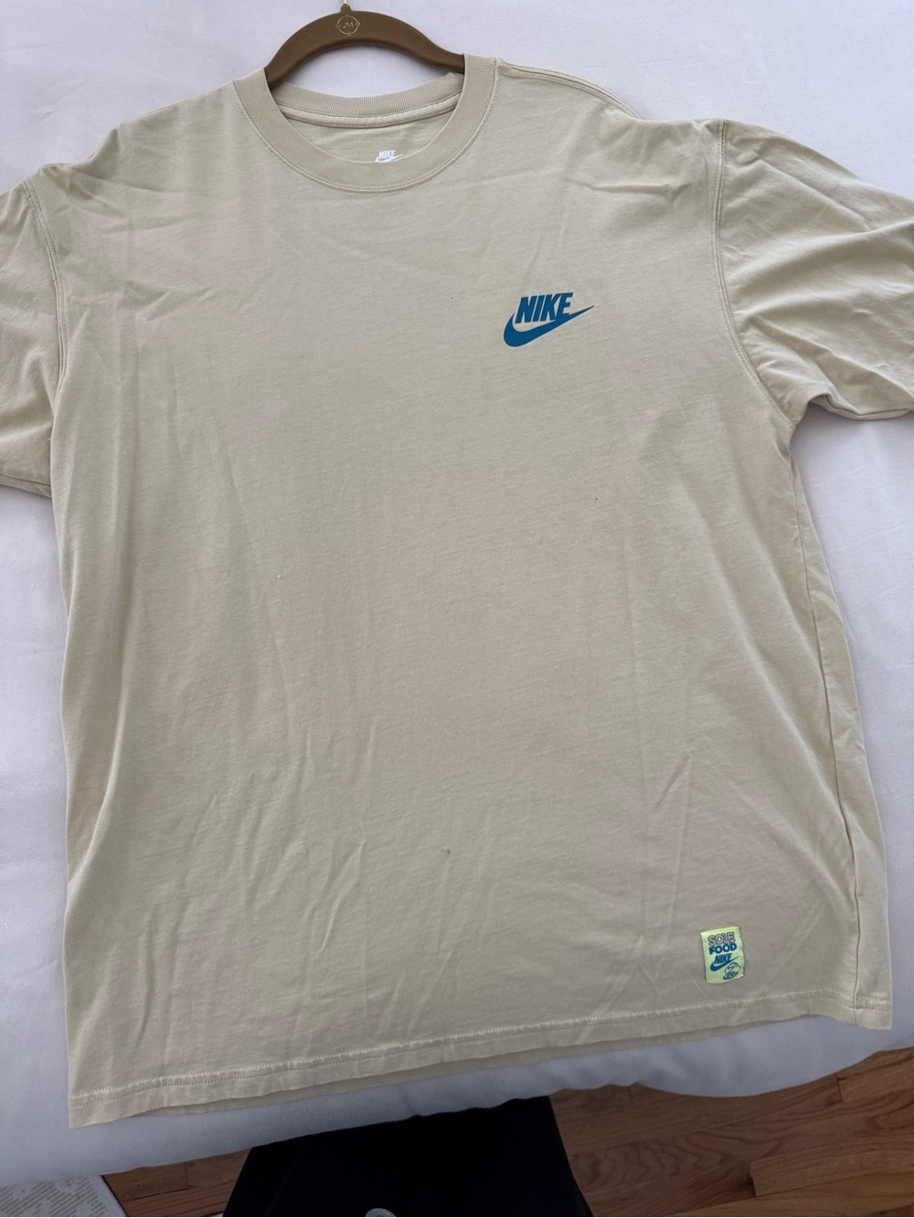 Nike Men's Cream Short Sleeve T-Shirt with Blue Swoosh